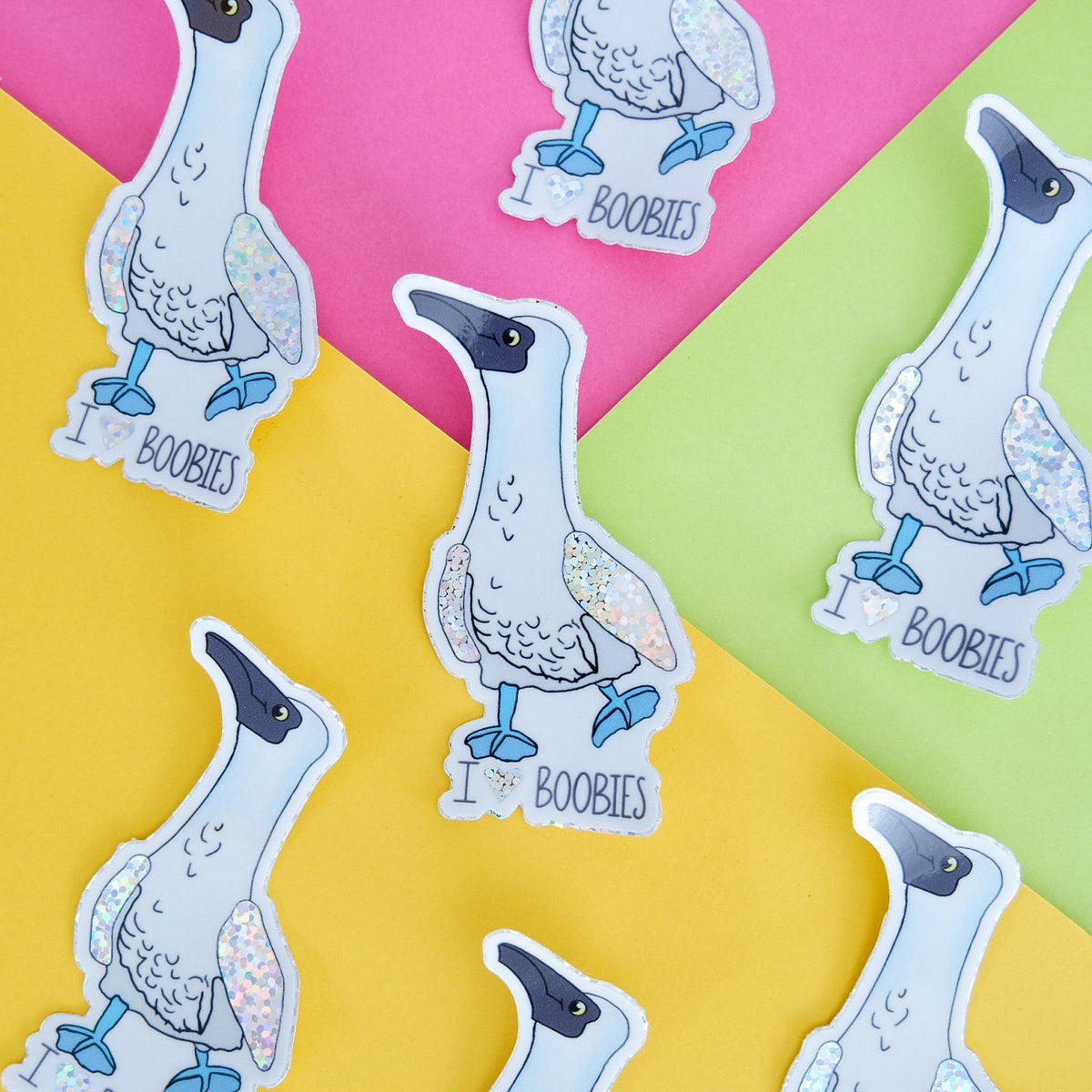 I Love Boobies vinyl sticker with a blue-footed booby and heart lettering displayed with matching pieces.