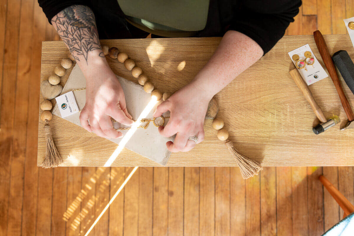 Kelsey arranging quartz necklace