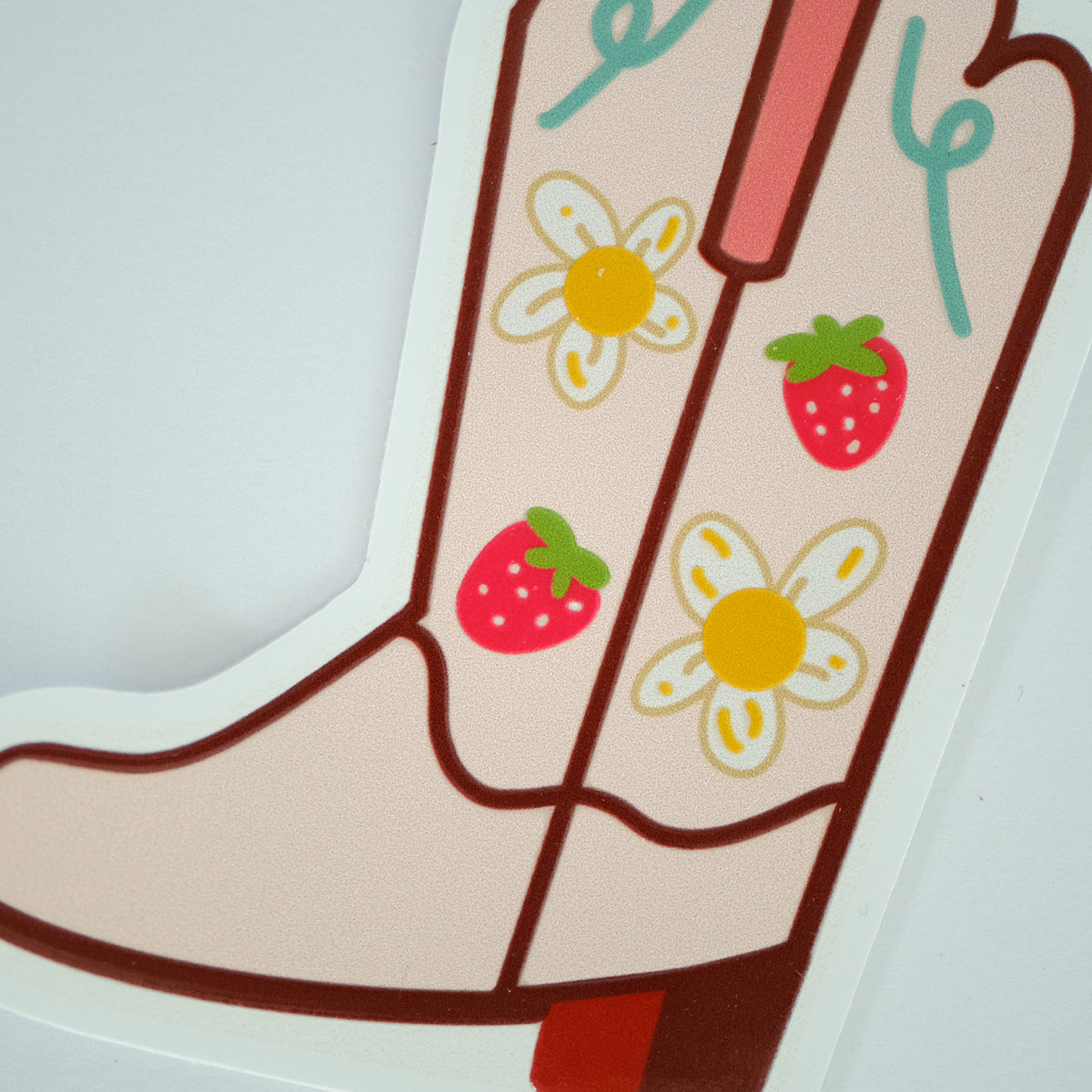 Close-up of Strawberry Cowgirl Boot Vinyl Sticker, showing the illustrated design and product details