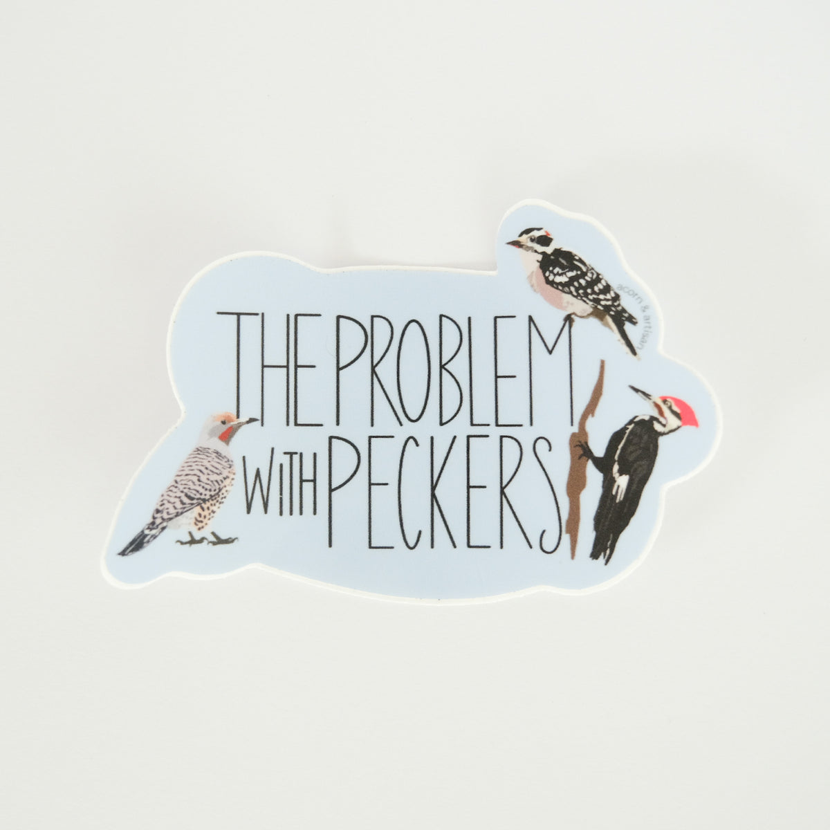 The Problem with Peckers vinyl sticker with illustrated woodpeckers.