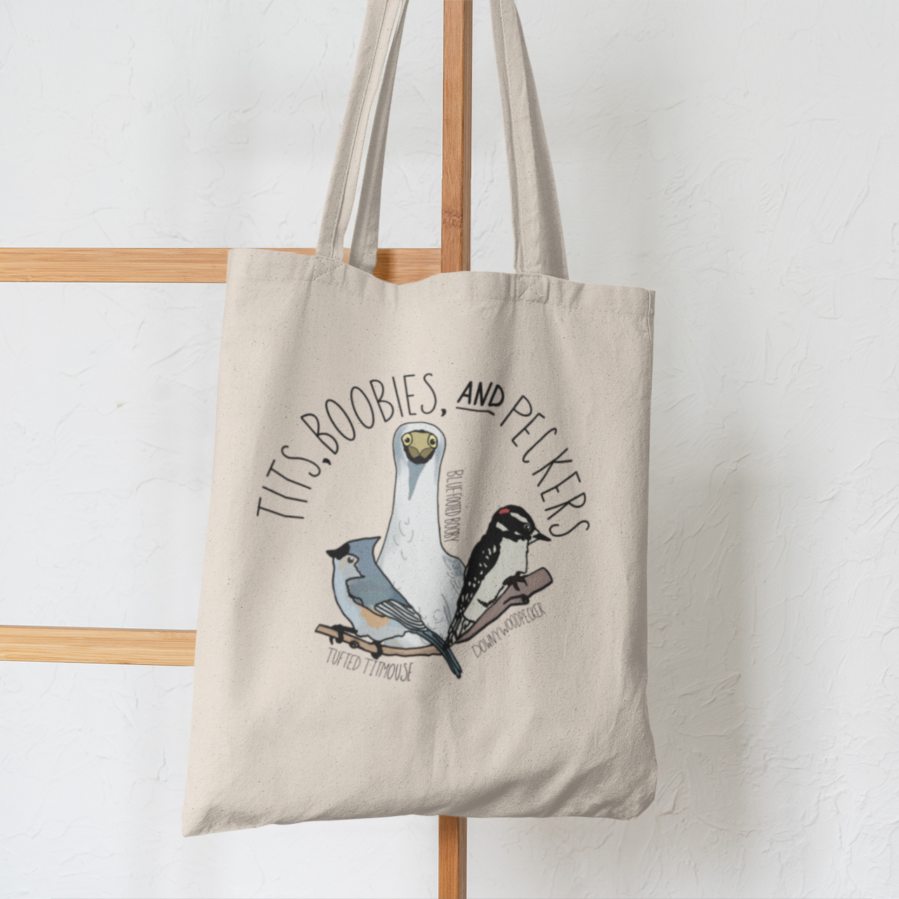 Close-up view of the 'Tits, Boobies, and Peckers' tote bag, highlighting the humorous bird illustrations