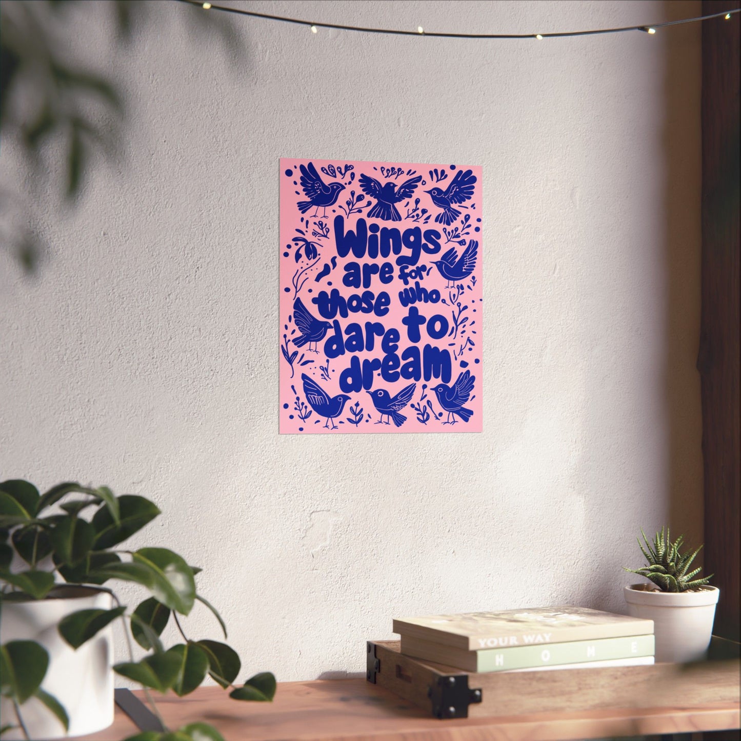 Inspirational 'Wings Are for Those Who Dare to Dream' poster styled as wall art in a cozy living room, adding a cheerful and motivational vibe.
