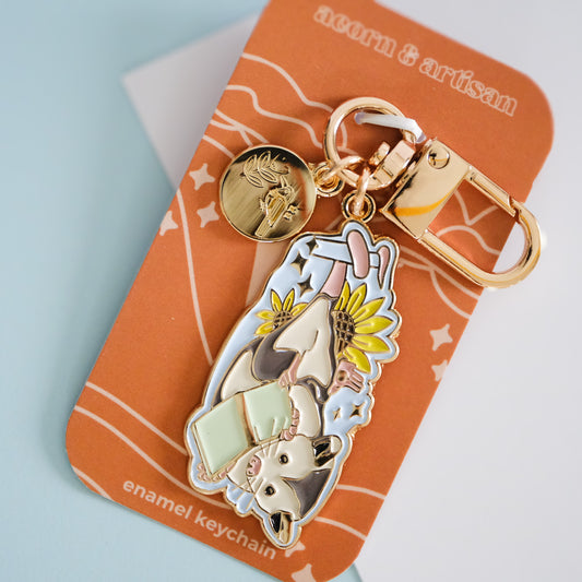Reading Opossum Enamel Keychain