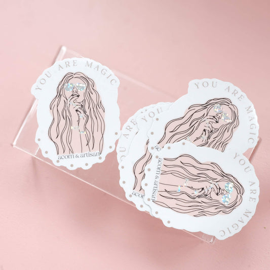 boho styled woman with jewelry and sunglasses under the wording "you are magic"