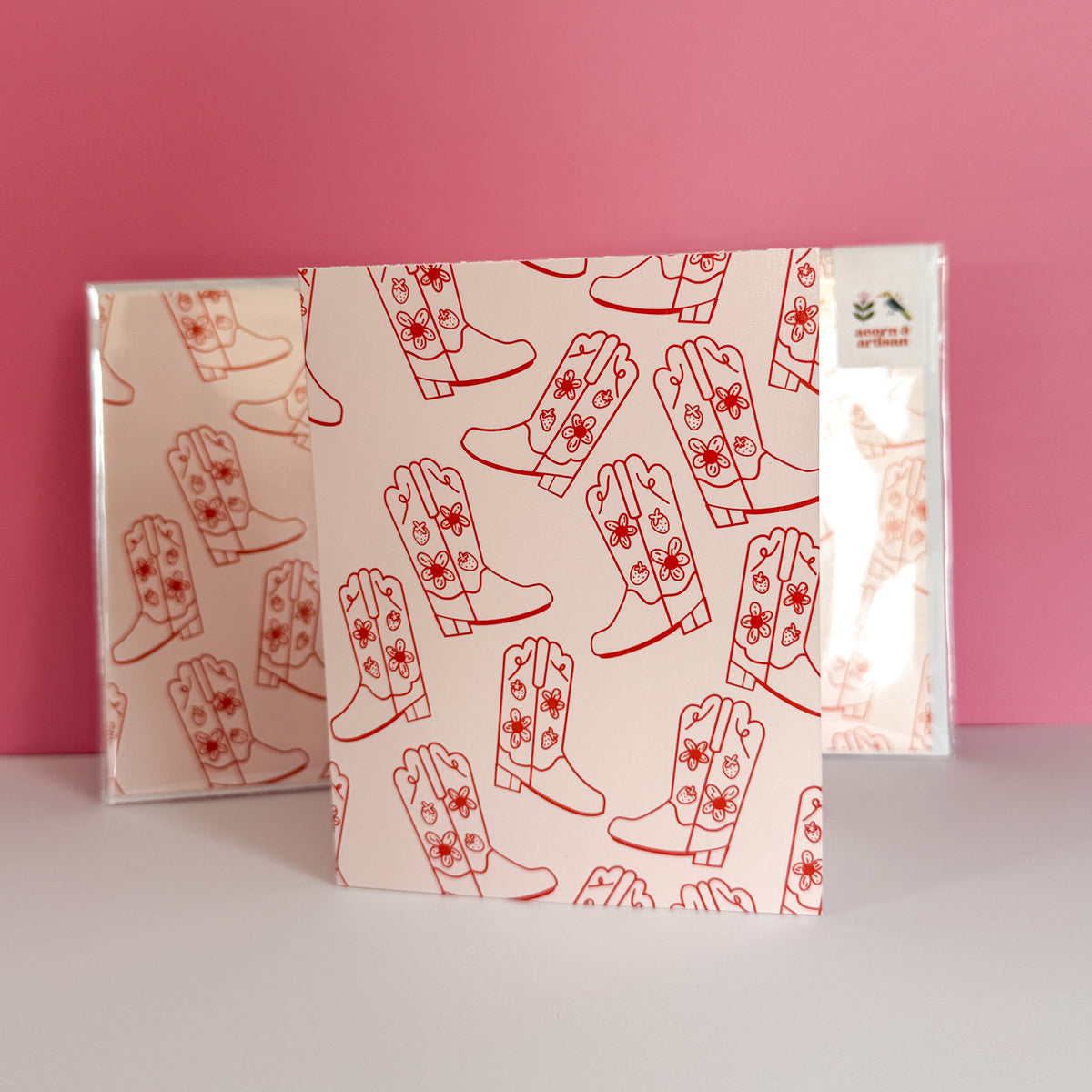 Strawberry Cowgirl Boot greeting card with a repeating red boot pattern on pink.