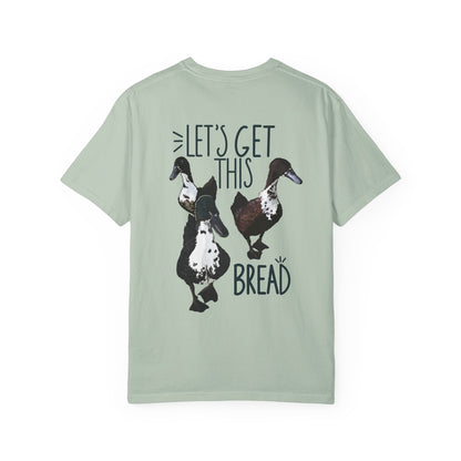 Light green t-shirt with duck graphic and text on a white background