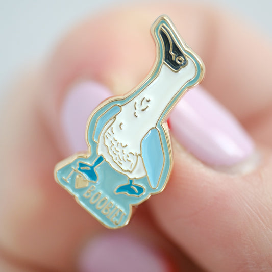 Close-up of Blue-Footed Boobie Enamel Pin, showing the illustrated design and product details
