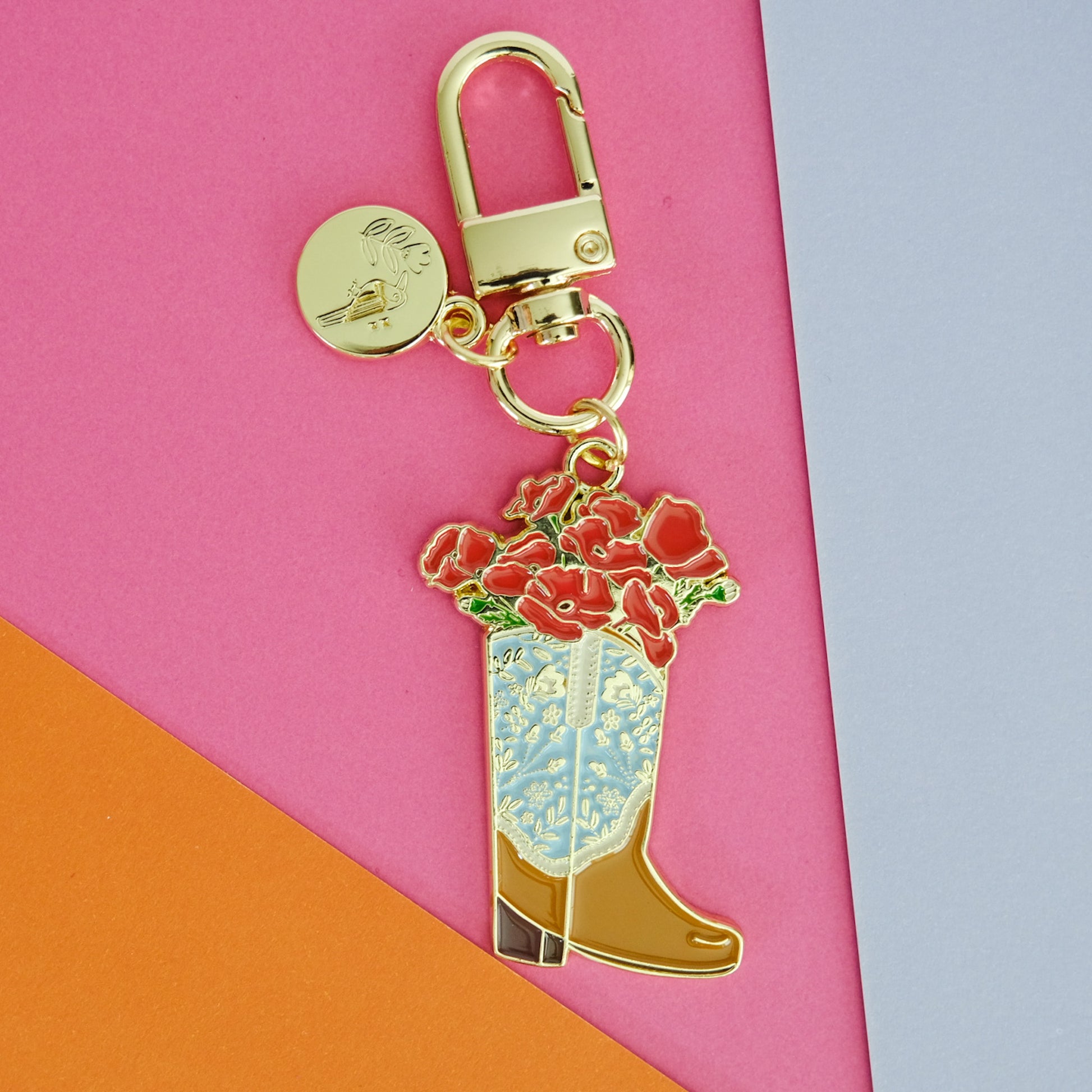 Flat lay of Poppy Cowgirl Boot Enamel Keychain, showing the full design