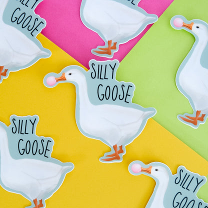 Silly Goose vinyl sticker with a white goose blowing pink bubblegum displayed with matching pieces.