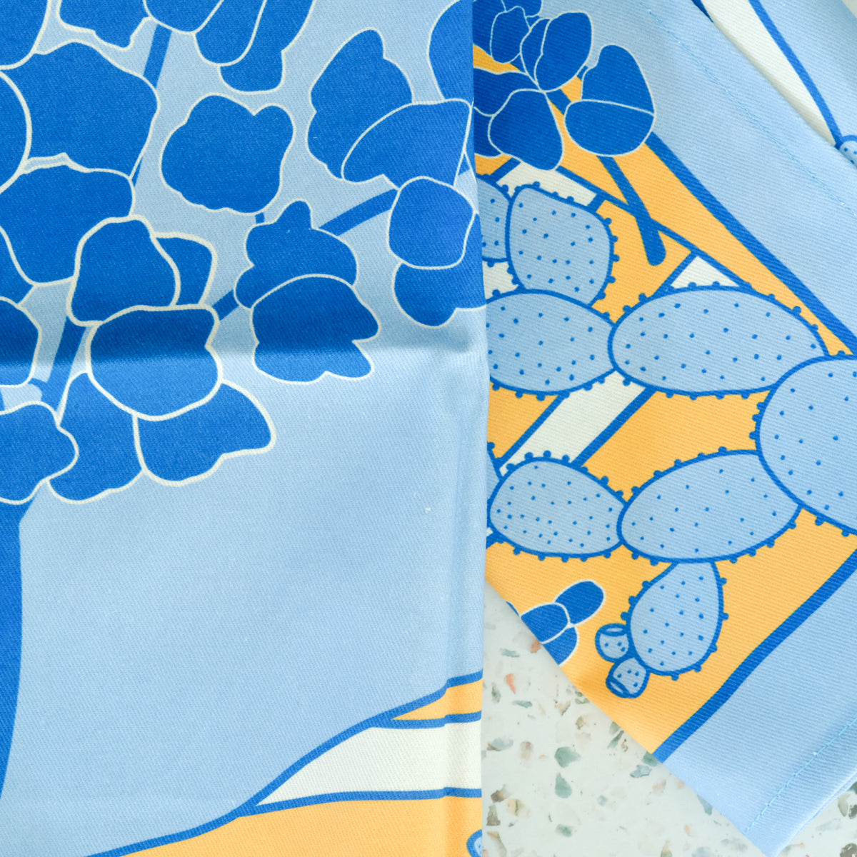 Detail view of Texas Hill Country Bluebonnets Tea Towel, showing the illustration and material
