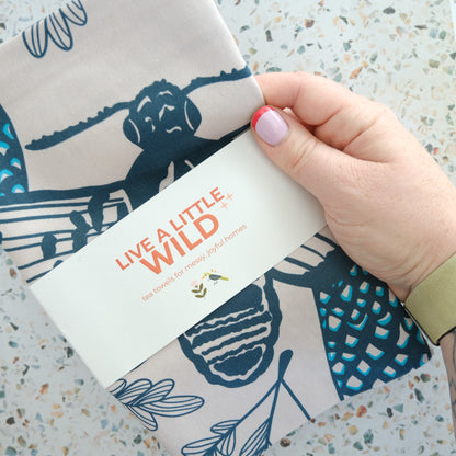 Texas Night & Brush Tea Towel styled in a colorful lifestyle setting