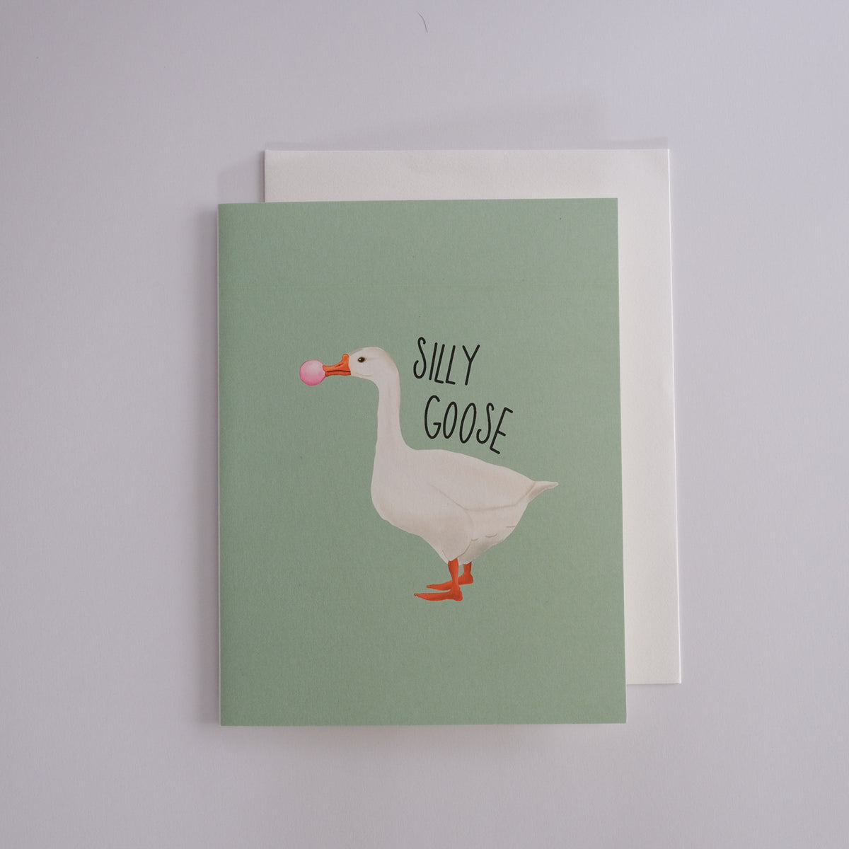 Silly Goose greeting card with a white goose blowing pink bubblegum.