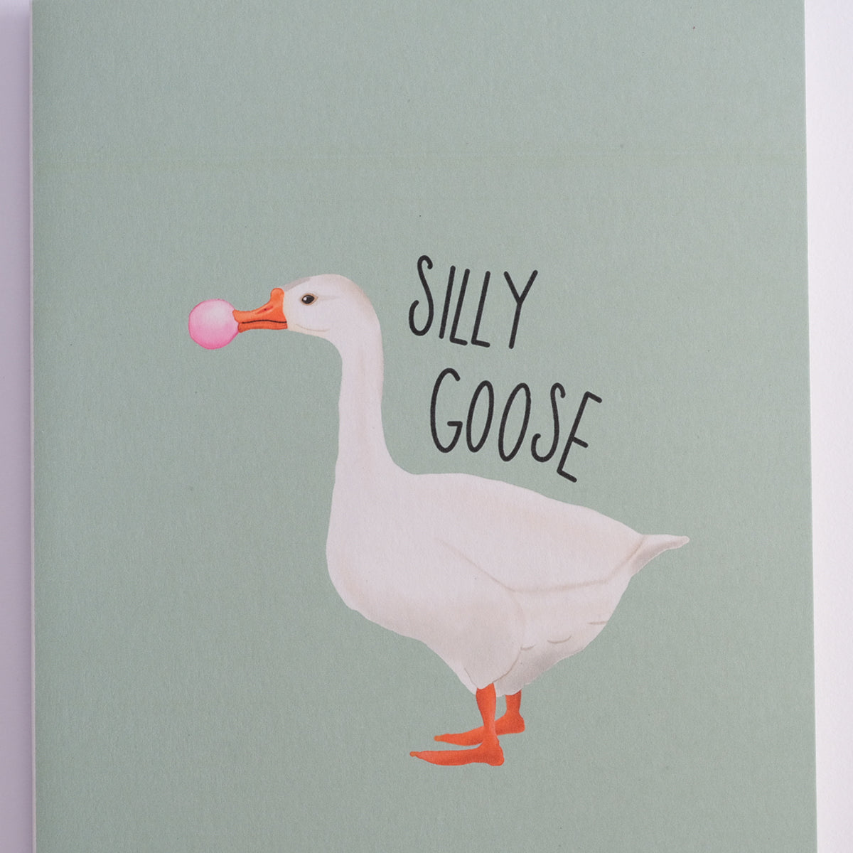 Silly Goose greeting card with a white goose blowing pink bubblegum.