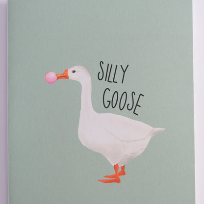 Silly Goose greeting card with a white goose blowing pink bubblegum.