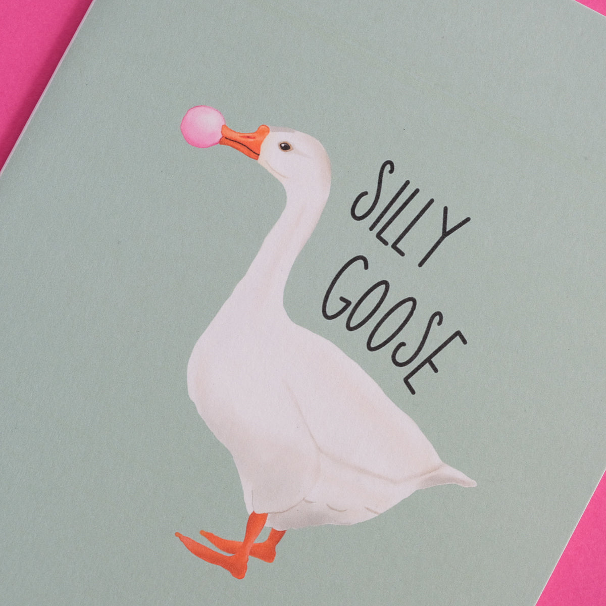 Silly Goose greeting card with a white goose blowing pink bubblegum.