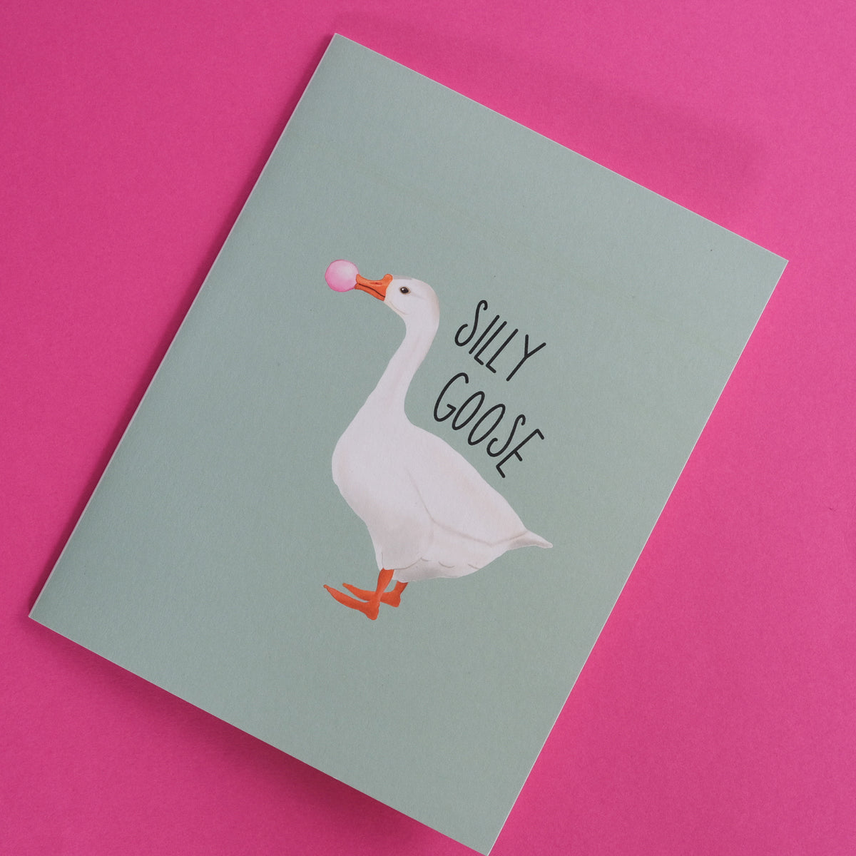 Silly Goose greeting card with a white goose blowing pink bubblegum.